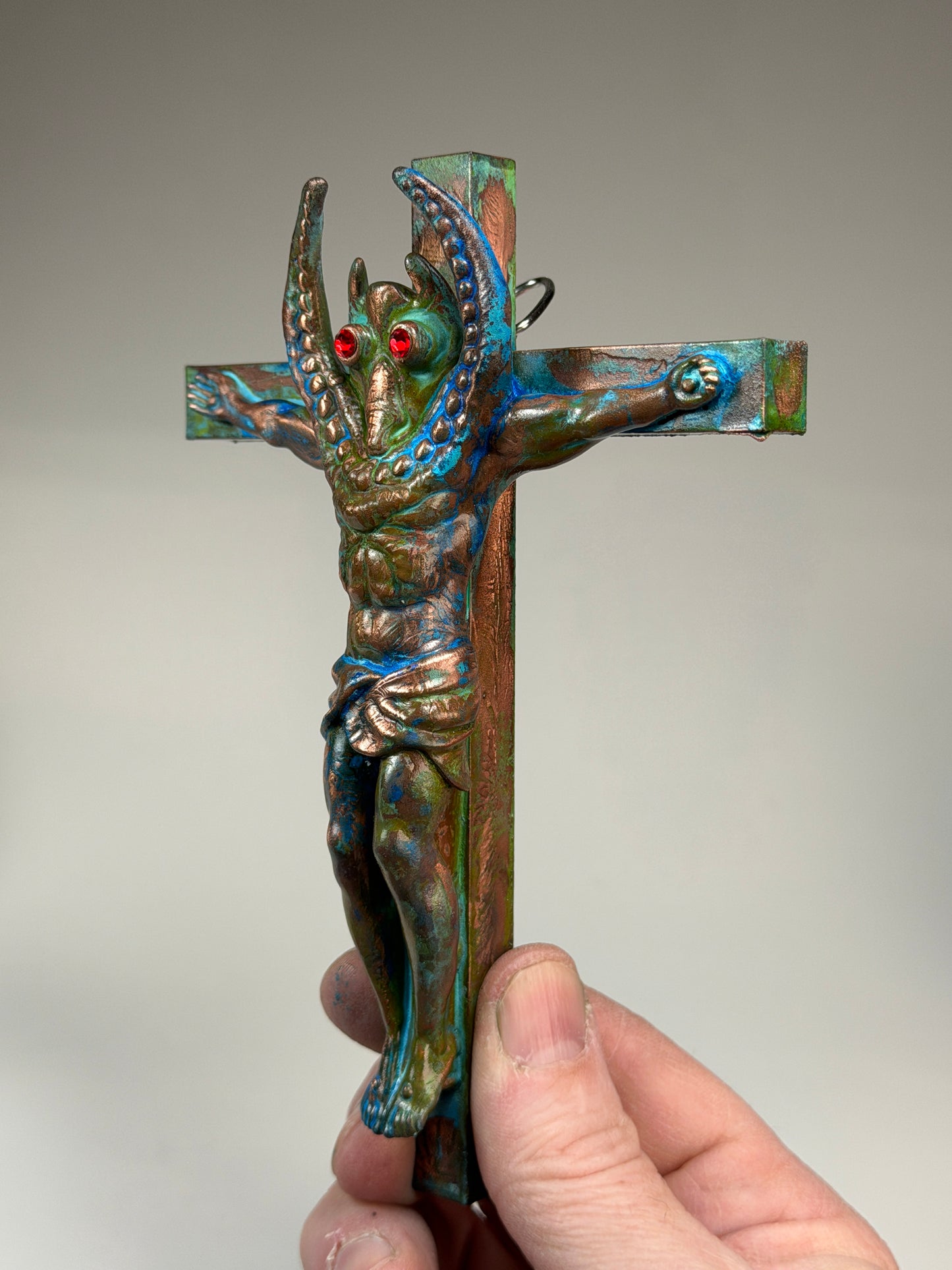 Christ on the Cross but he is Sammy Smiles: Copper Plated Grin