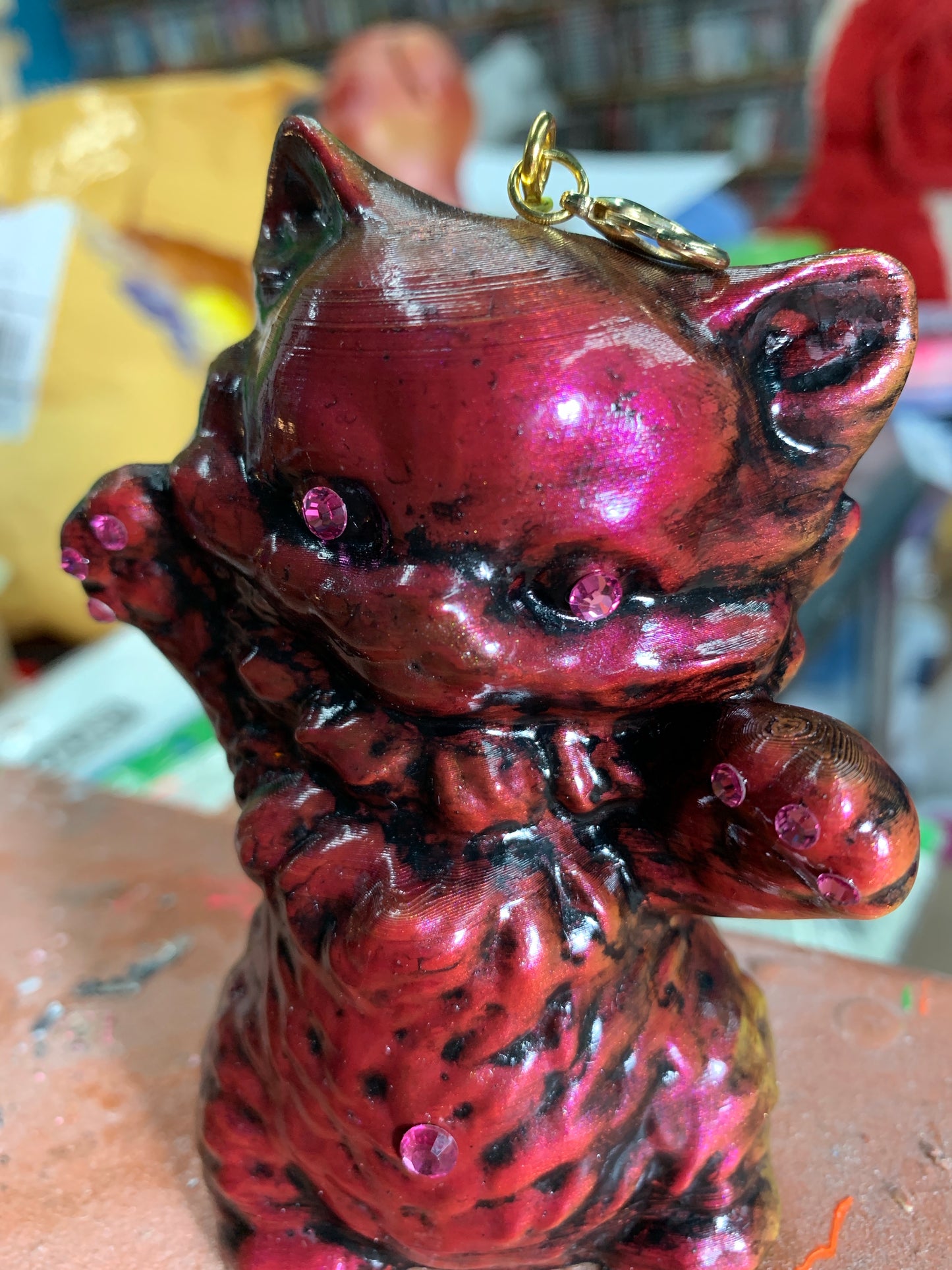 Theo’s cat necklace charm thing