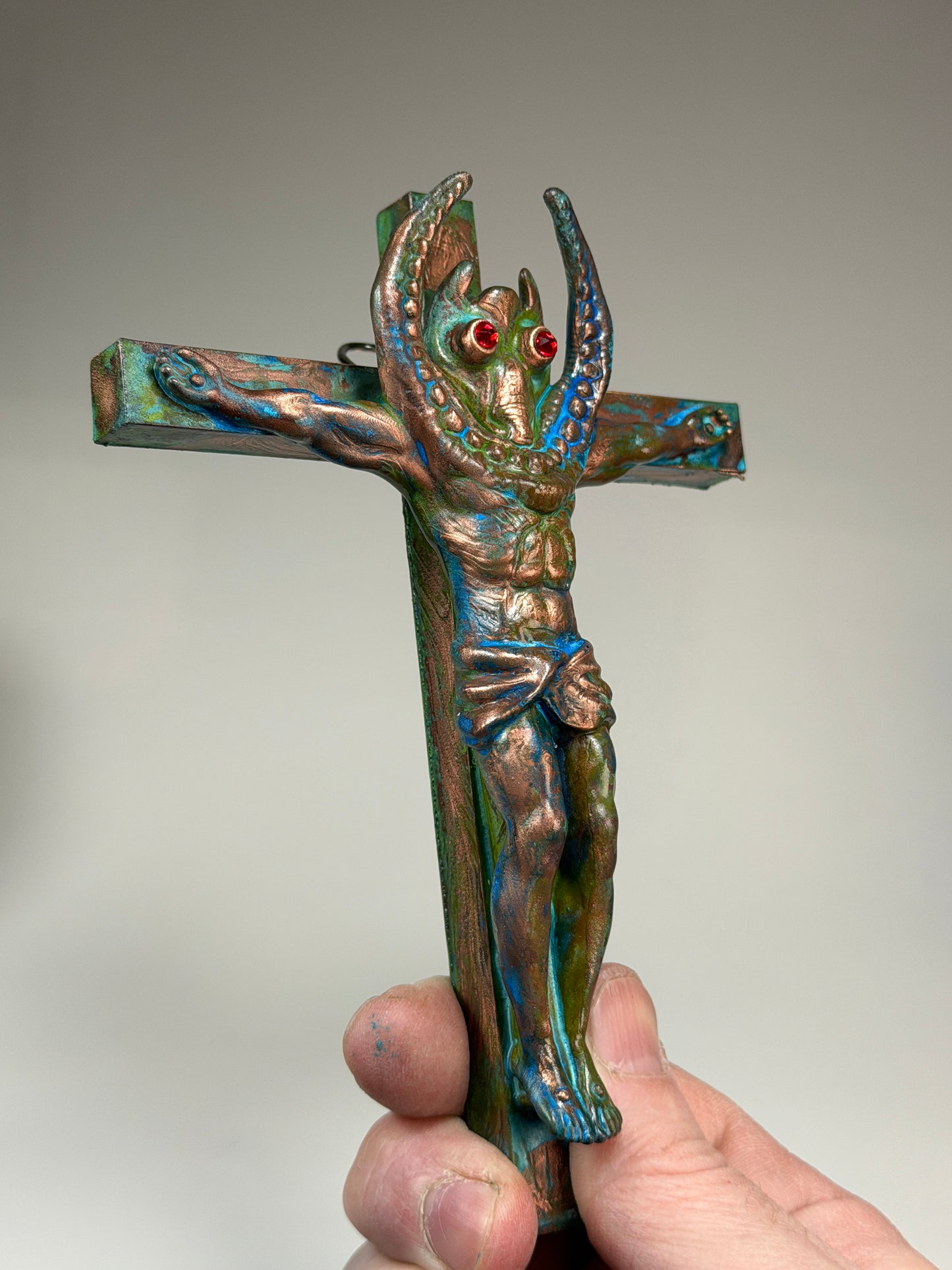 Christ on the Cross but he is Sammy Smiles: Copper Plated Grin