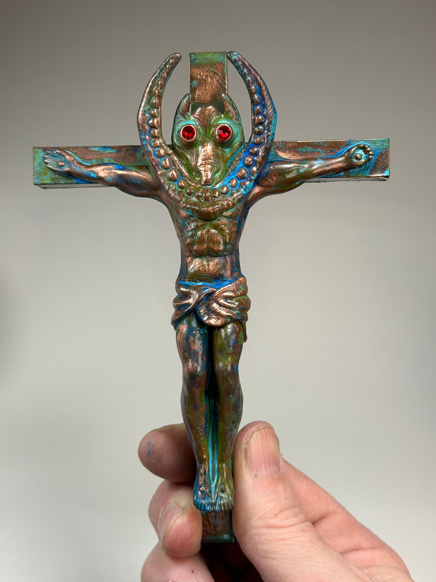 Christ on the Cross but he is Sammy Smiles: Copper Plated Grin