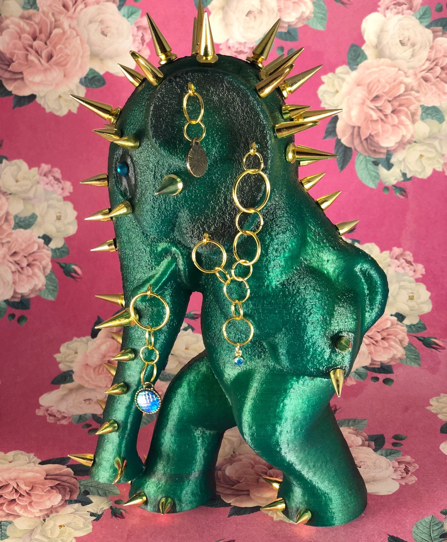 Waking Elephant: Translucent Green with Black. Gold Spikes and Such