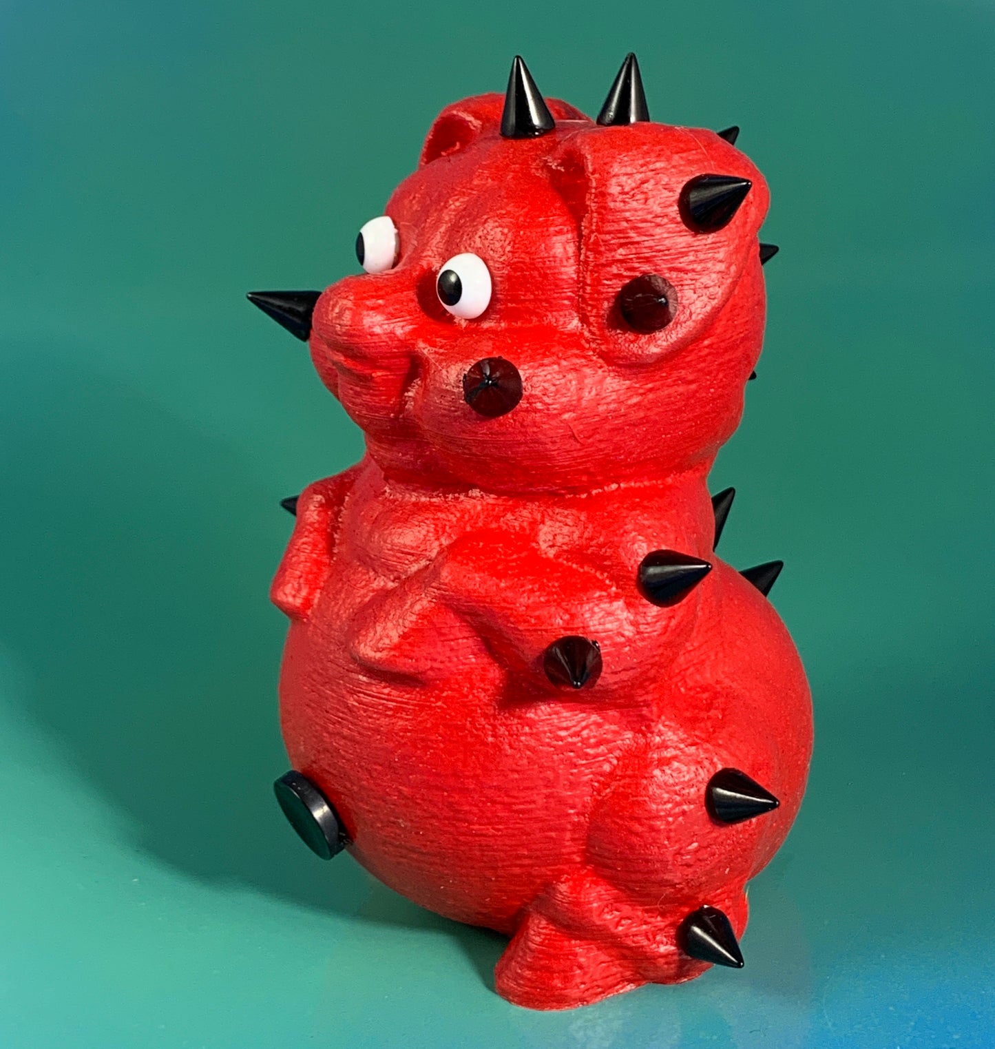 Rubber Coated Red Pig with Black Spikes