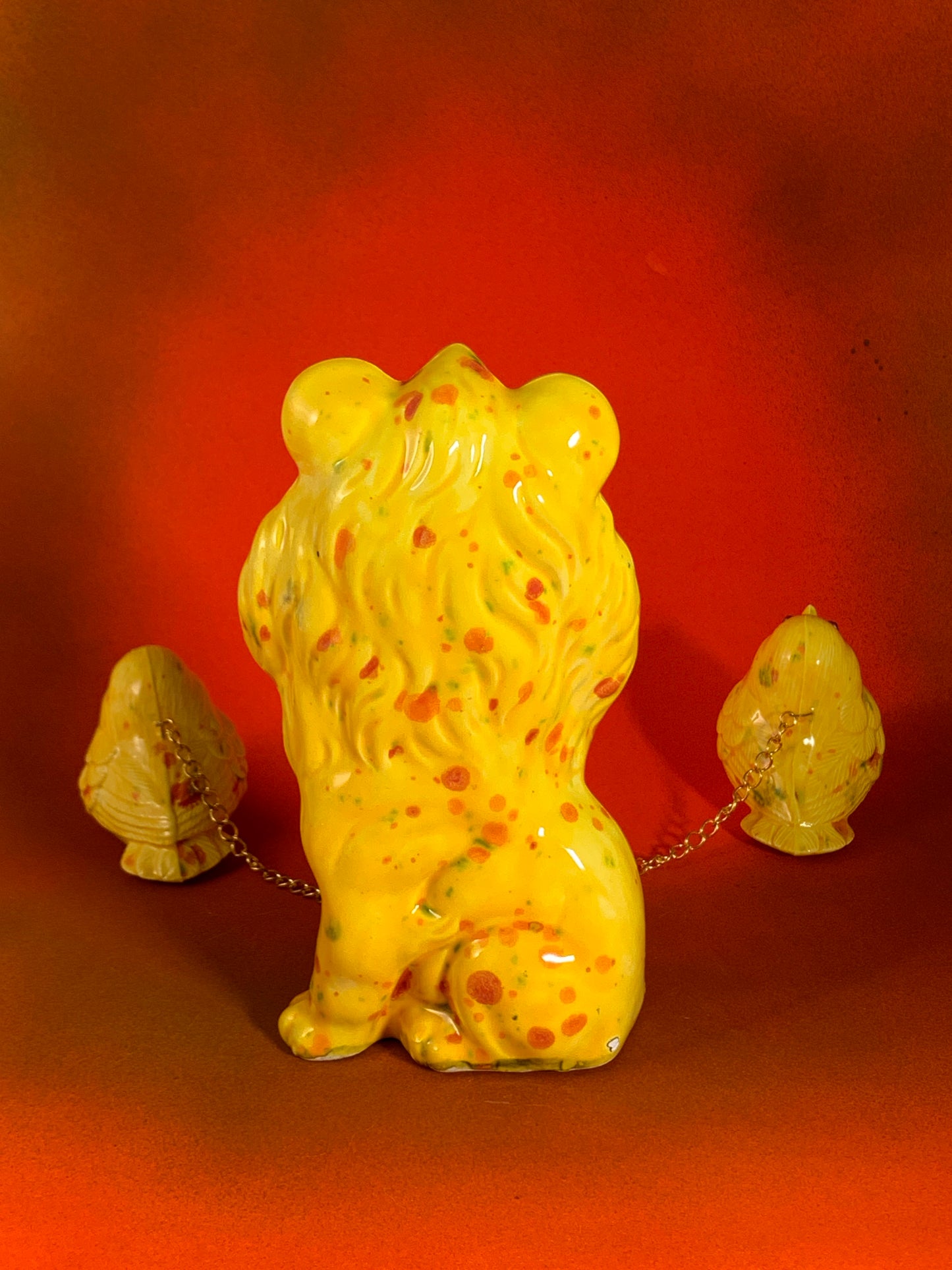 Yellow Lion Chained to Birds