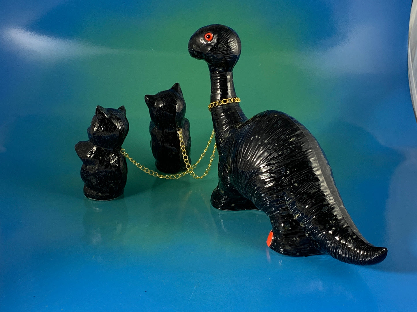 Black Dino Chained to Black Cats