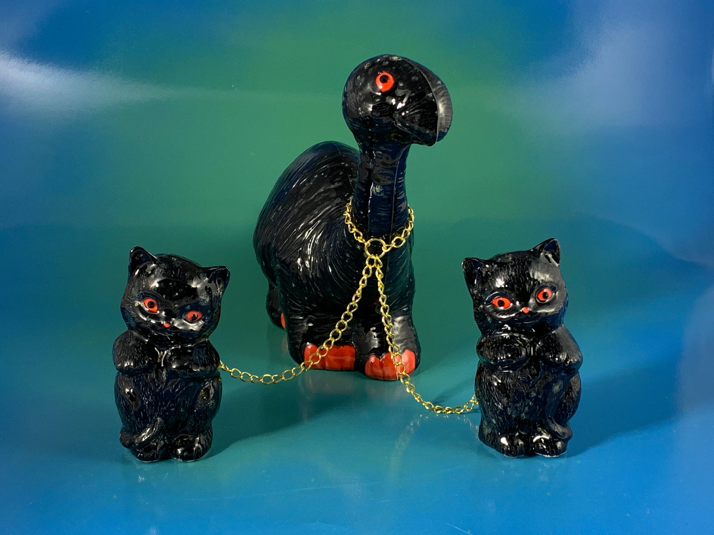Black Dino Chained to Black Cats