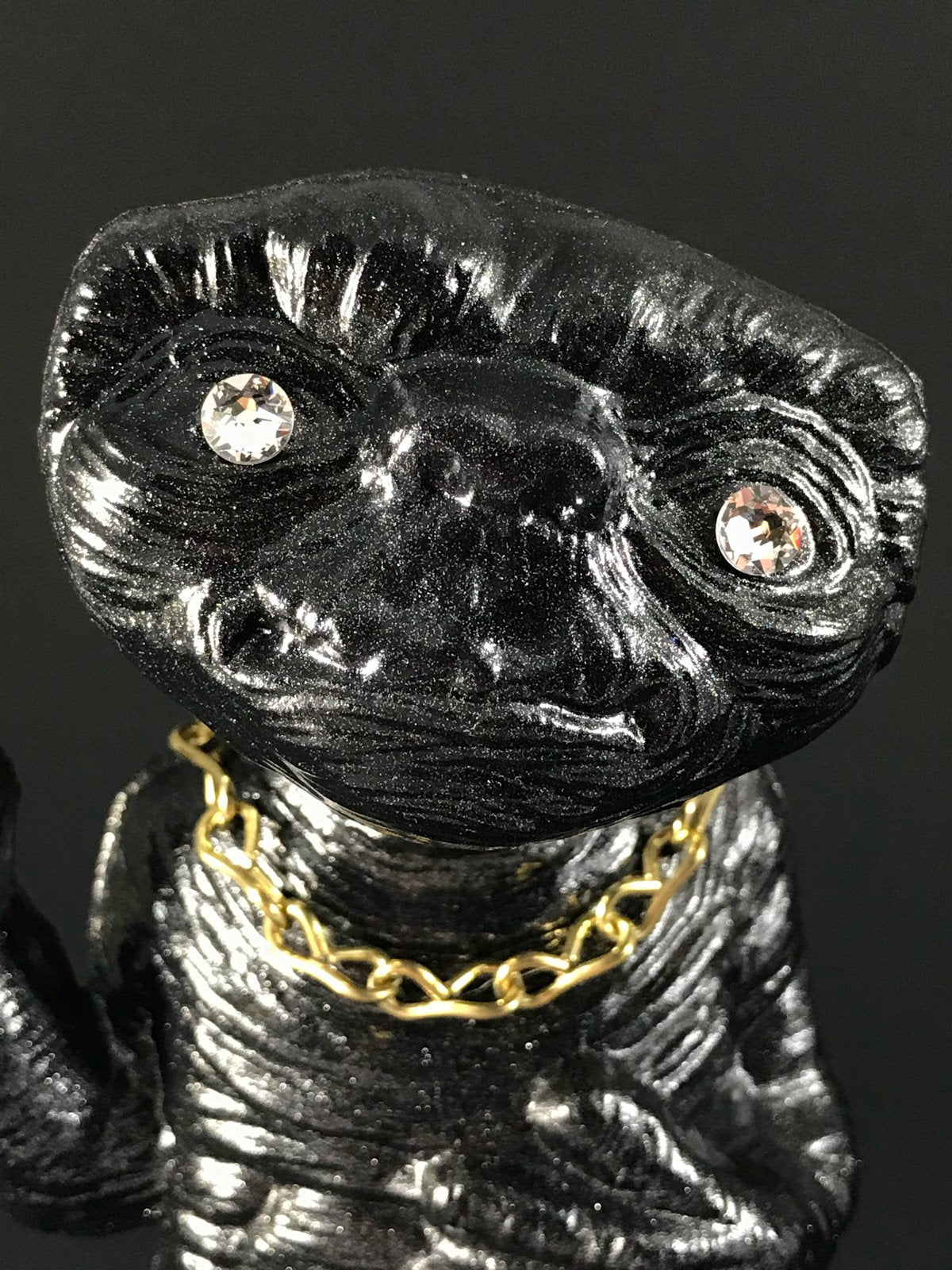 Black ET with rhinestone eyes, gold chain and metal flake
