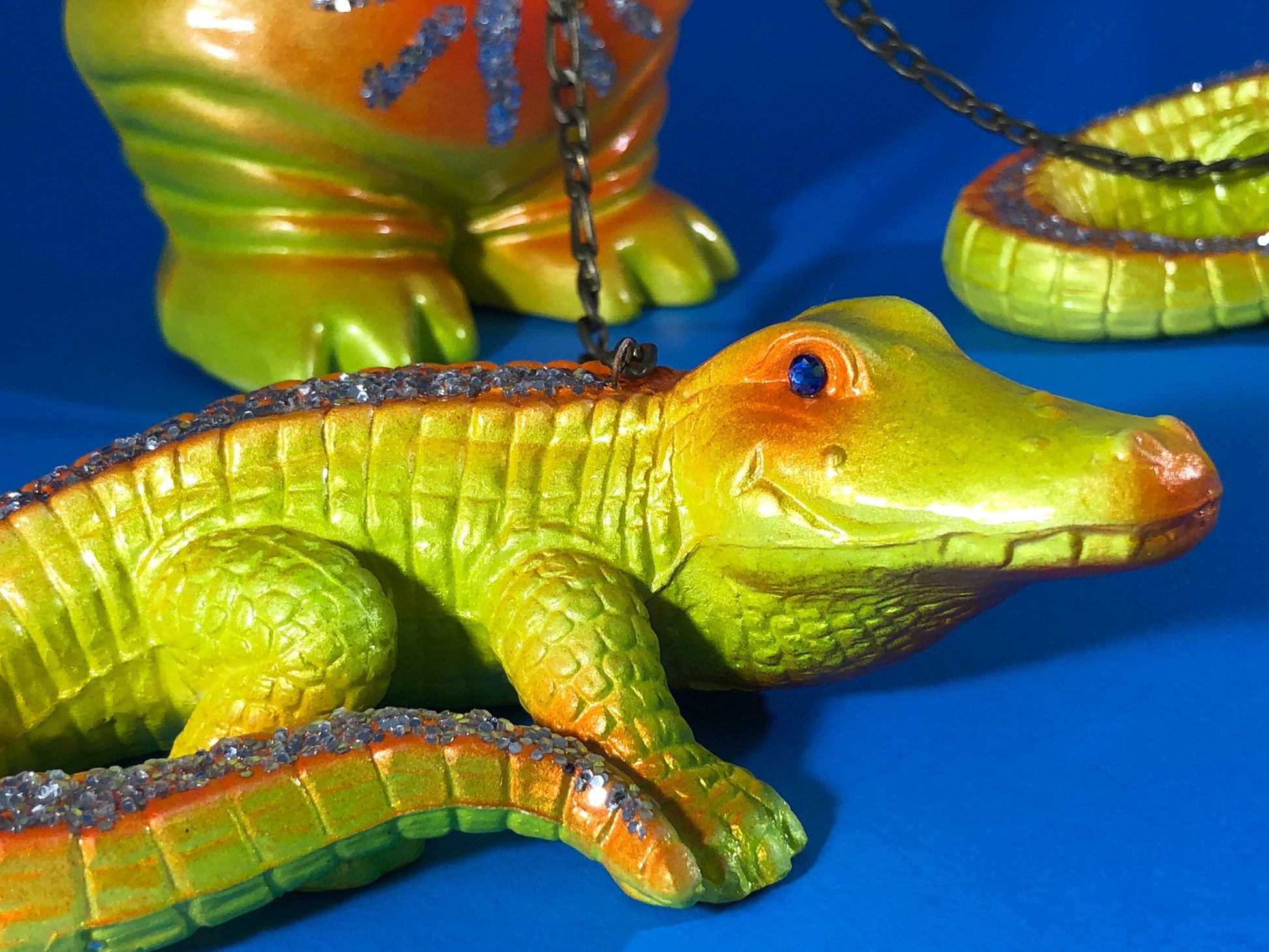 Stomachache and headache ET with crocodiles: Yellow and orange with glitter and chains