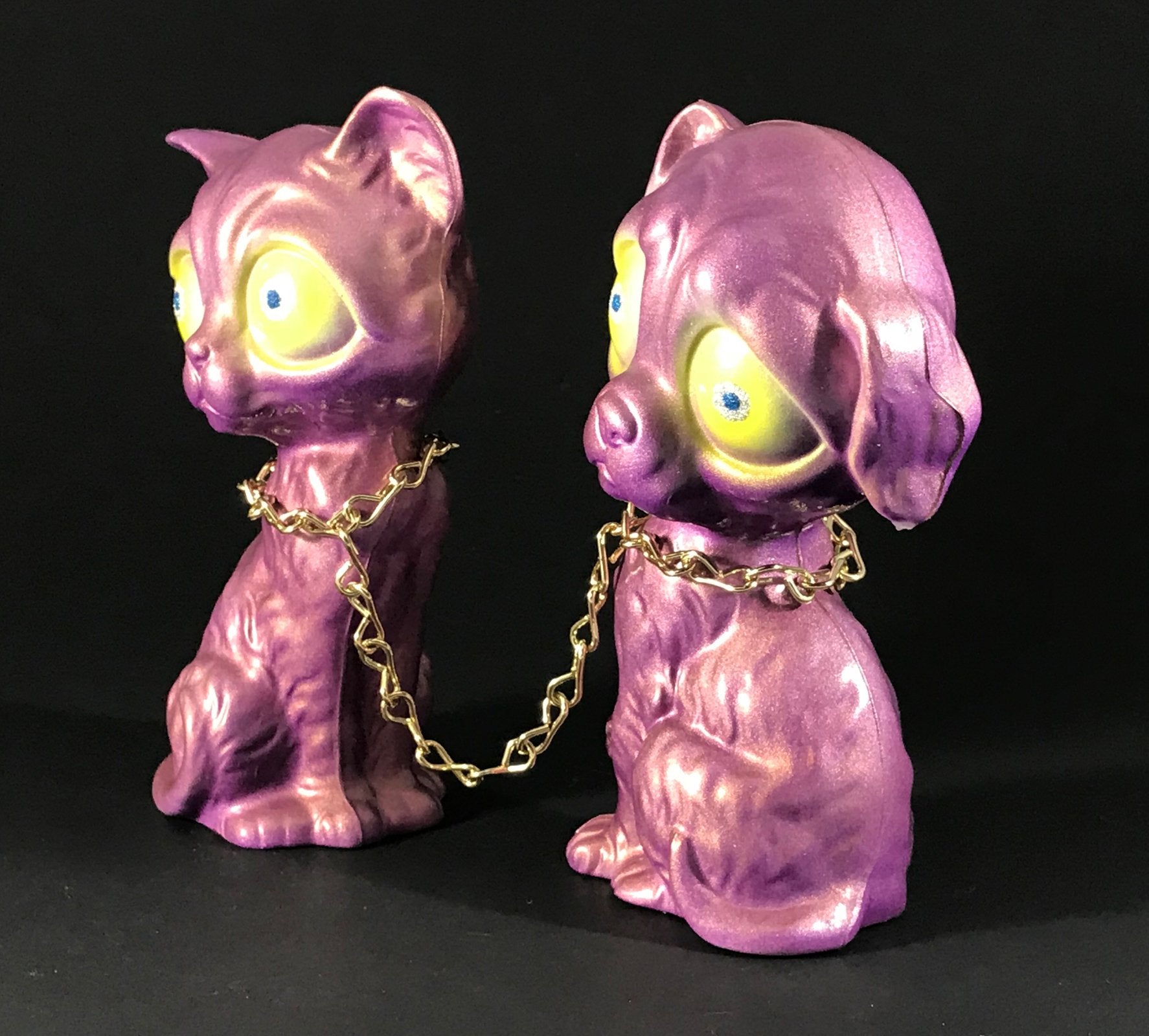 Chained sad dog and sad cat, iridescent purple/gold with metal flake/glitter eyes